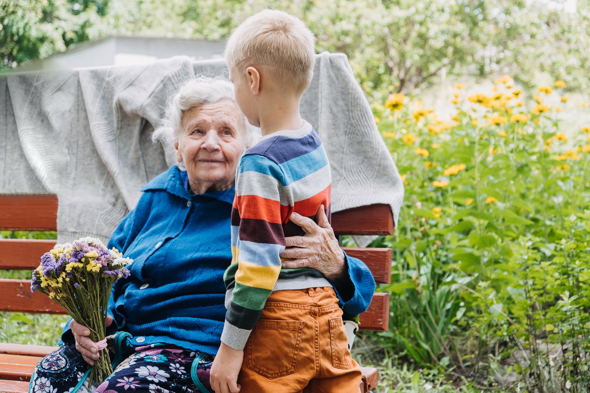 Granny with grandsons enjoying time together outdoor.